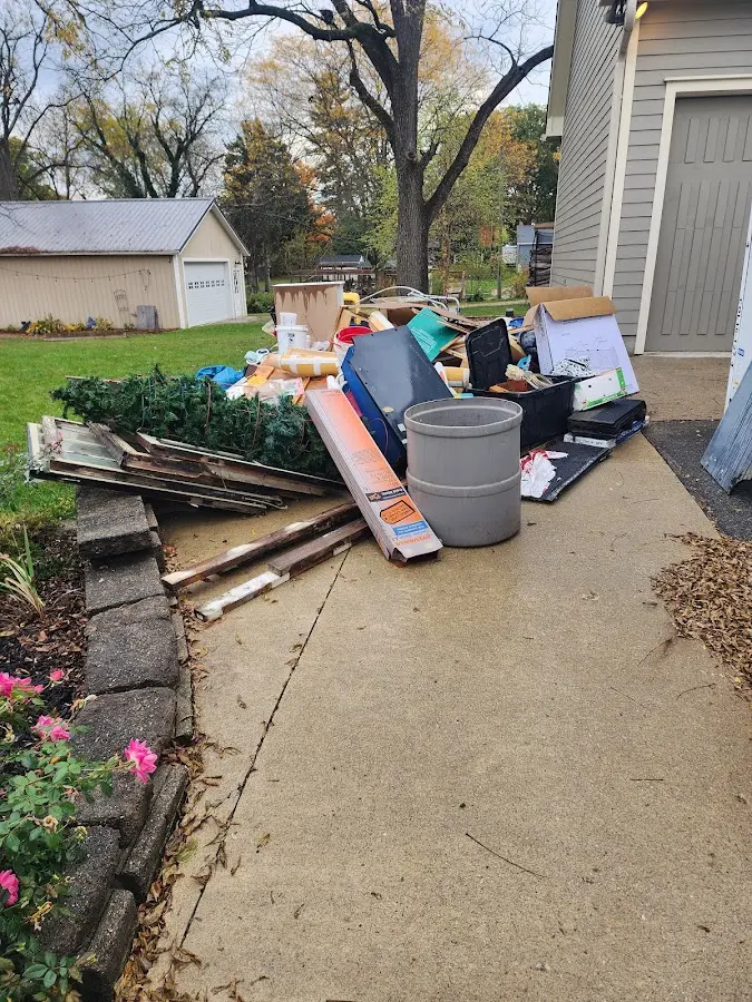 Dumpster being loaded with debris for Commercial Dumpster Rental in Brownwood